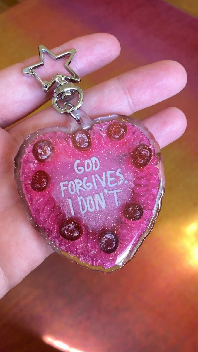 GOD FORGIVES Keychain
