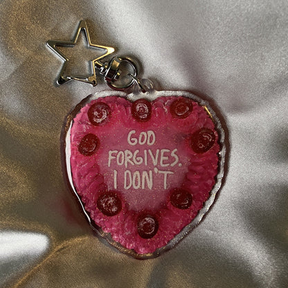 GOD FORGIVES Keychain